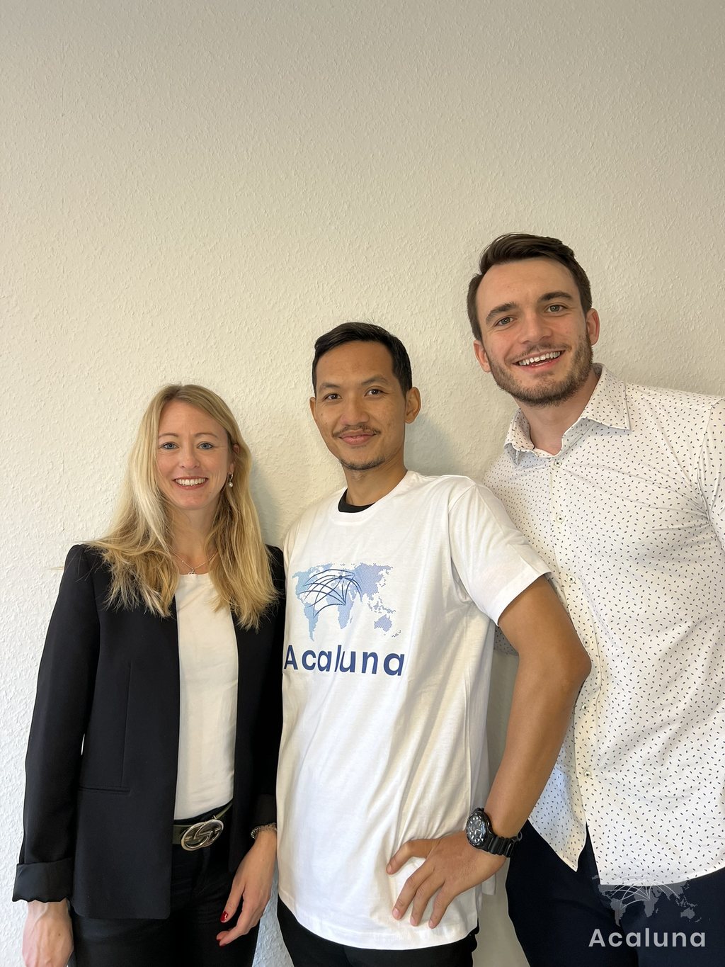 Three members of the Acaluna team, one of them wearing an Acaluna T-shirt