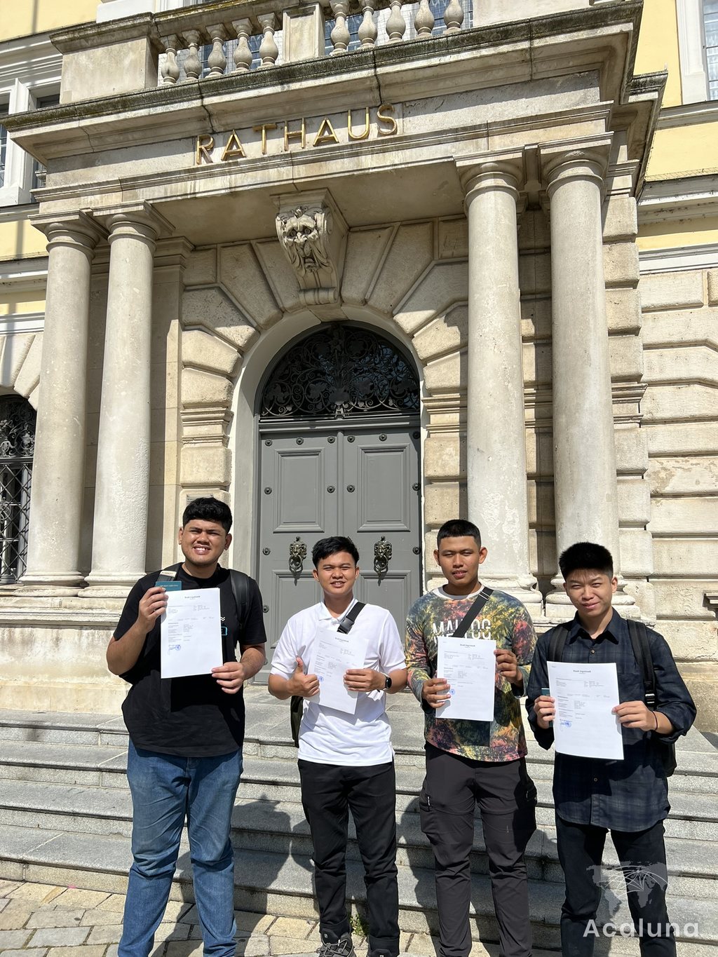 Apprentices in front of a German town hall, shortly after arrival